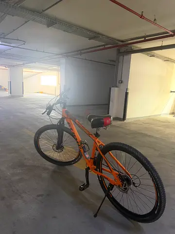 Orange mountain bike - good condition