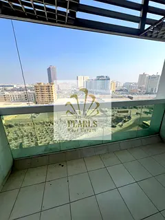 Annual rent in Ajman Al Rashidiya 1, Pearl Towers, 2 bedrooms and hall, 2 bathrooms, 2 balconies, pr