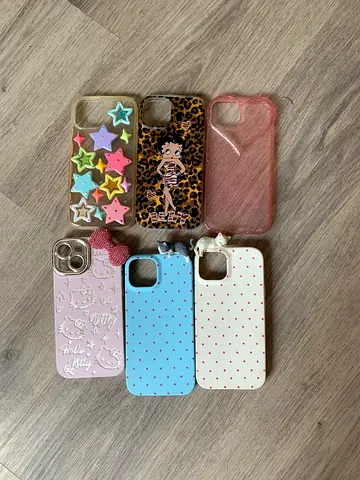 Set of 7 iPhone 15 protective cases — assorted designs, good condition