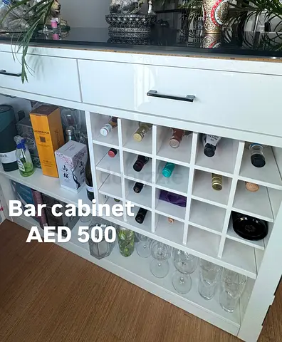 White wooden bar cabinet with wine rack and storage - good condition