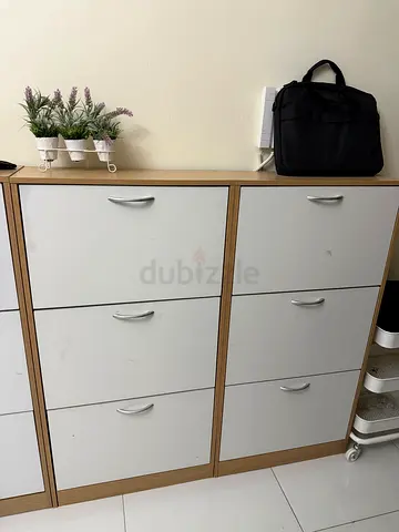 Wood-frame 6-door shoe cabinet with white doors — good condition