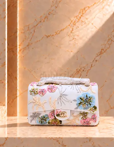 White floral embroidered shoulder bag with gold-tone CC clasp