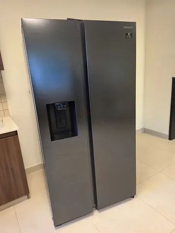 Samsung brand side by side door refrigerator with water dispenser