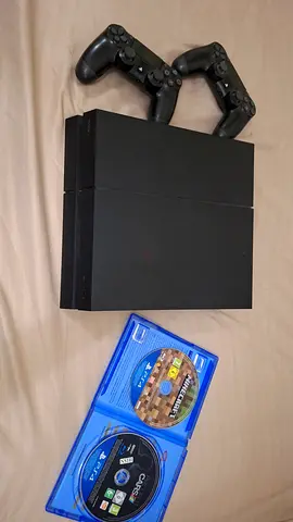 Sony PS4 Slim with 2 DualShock Controllers and 2 Games (Minecraft & Cars) - Good Condition