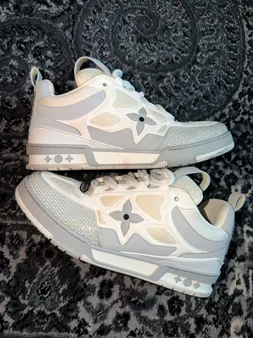 Louis Vuitton LV Trainer Maxi sneakers in white and silver.