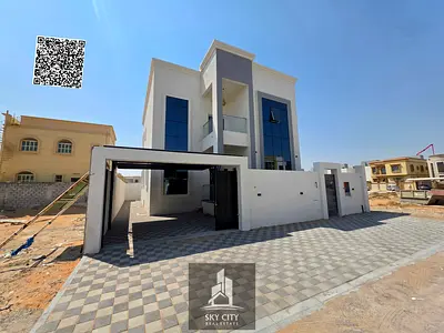 Two-story villa for sale on Sheikh Mohammed Bin Zayed Road, behind Al Humaidiya Park; features 4 master bedrooms.