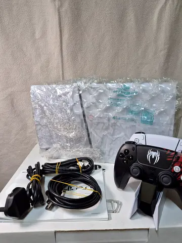 Ps5 slim digital edition with 2 controllers Marvel's Spider-M and charging station and box included