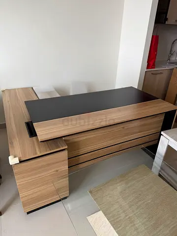 L-shaped modern wooden office desk with storage — used
