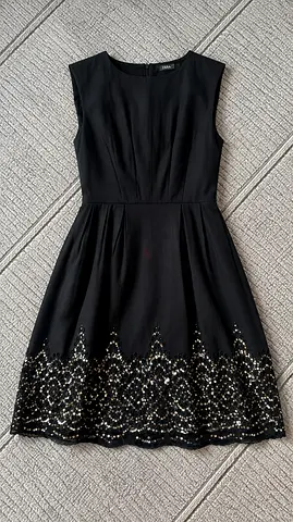 Black sleeveless cocktail dress with sequin scalloped hem - size M