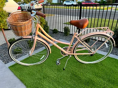 Light pink city/commuter bicycle with basket and rear rack - good condition