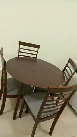 Wooden 4-Seater Oval Dining Table with Cushioned Chairs - Good Condition