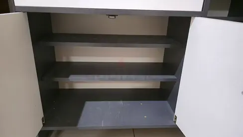 Grey storage cabinet with shelves — excellent condition. Almost new.