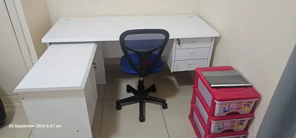 White L-shaped Office Desk with Drawers and Swivel Chair