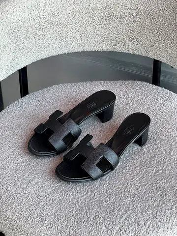 Black leather open-toe heeled slides, size unknown - gently used