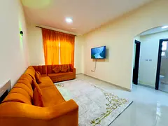 Furnished One-bedroom apartment with a living room for monthly rent in Ajman – Al Rashidiya 3 | Ti