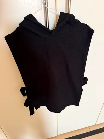Black sleeveless knit top with side ties - size M