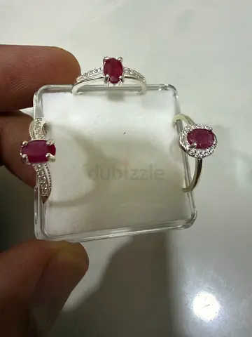 Three sterling rings with oval pink/red ruby gemstones (set of 3)