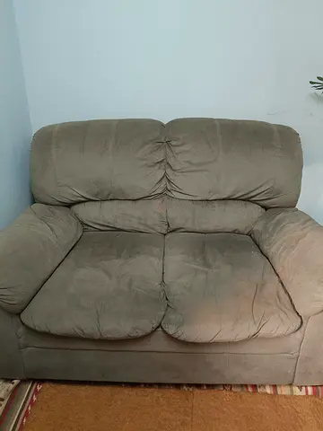 Two-seater fabric loveseat in beige — good condition