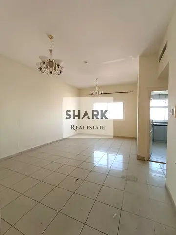 Cheapest 1-bedroom apartment in Al Majaz 2 – *Free central A/C (paid by landlord) + parking included. Prime location on Jamal Abdel Nasser Street, rig