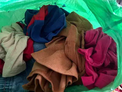 Bundle of mixed used clothing - assorted sizes and colors