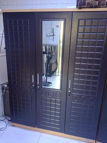 We are selling used 3 door cabinet for sale  wood good Condition  black colour