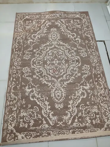 Light brown vintage-style area carpet