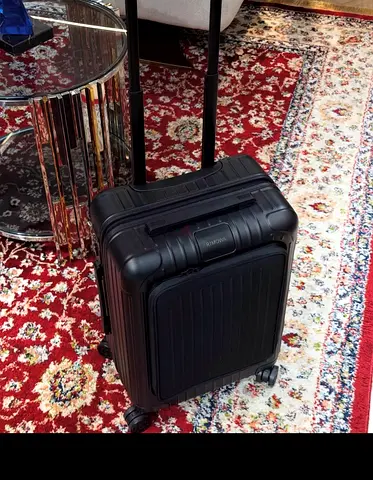 Rimowa Black hard-shell carry-on suitcase with front pocket and wheels