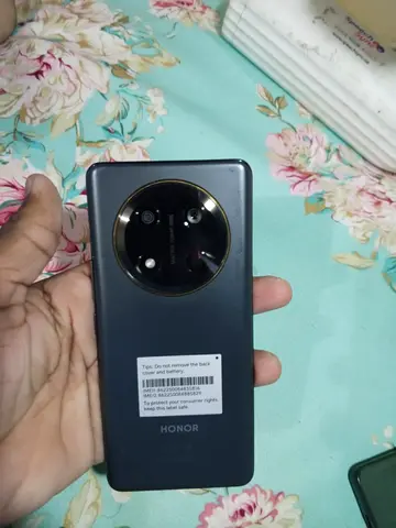 Honor smartphone with circular quad-camera - used, good condition