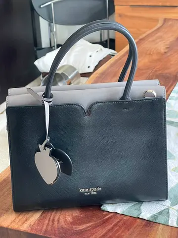 Original Kate Spade black leather top-handle handbag with charm - excellent condition