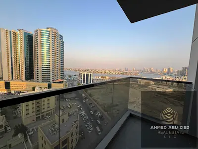 A beautiful one-bedroom apartment with a living room and balcony offering a sea view. It features two bathrooms, built-in wardrobes, and parking, with