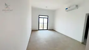 A spacious two-bedroom apartment with a living room and high-end finishes, featuring three bathrooms
