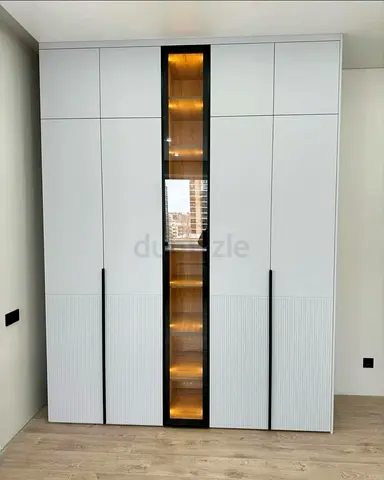 Modern built-in wardrobe with display shelf and LED lighting