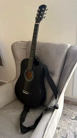 Budget Acoustic Guitar w/ Strap & Pick. Bag included.