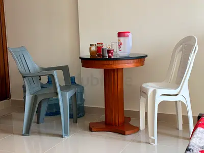 Small round wooden pedestal table — perfect for balcony or dining