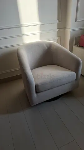 Light grey upholstered swivel lounge chair - good condition