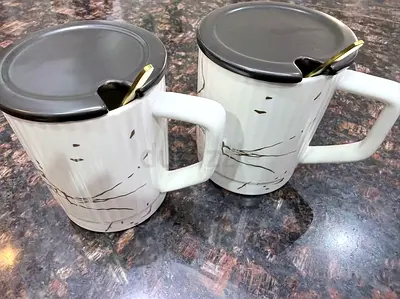 Set of 2 ceramic mugs with lids and spoons - never used, flawless, price negotiable