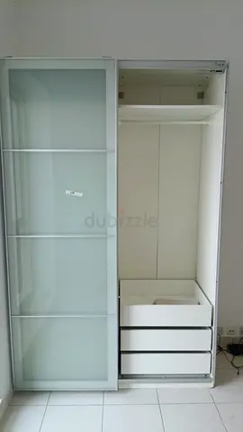 White sliding-door wardrobe with drawers — good condition