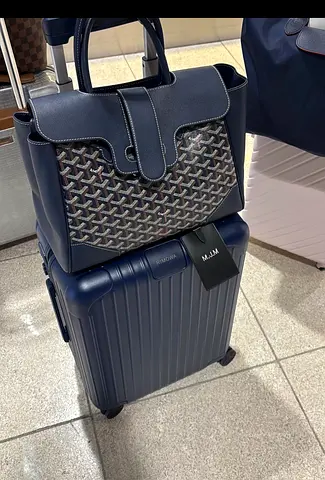 Navy Goyard Leather Tote Bag & Rimowa cabin suitcase