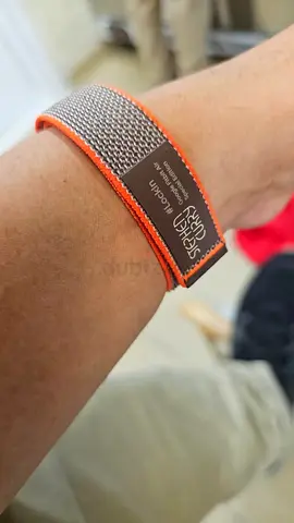 Orange-trim fabric wrist strap / bracelet — gently used