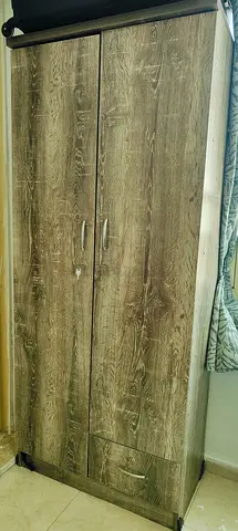 Two-door wooden wardrobe with drawer - good condition