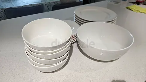 Set of white ceramic bowls and plates