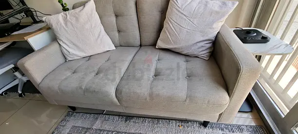 Light grey 2-seater fabric sofa in good condition