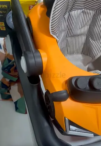 Baby walker with removable toy tray and cushioned seat - good condition