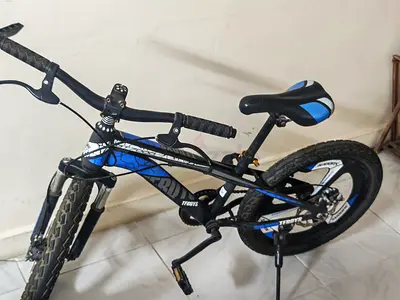 Used black & blue kids/teen mountain bike with front suspension