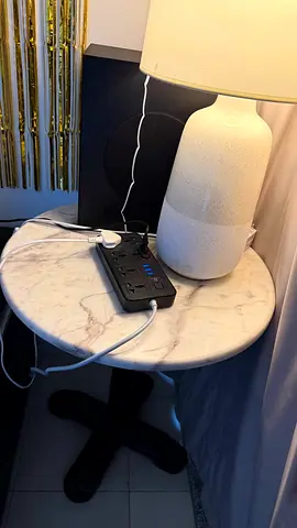 2 round marble-top side table with black pedestal base 1 black and 1 white