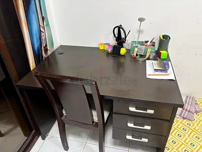 Dark wood study desk with three drawers