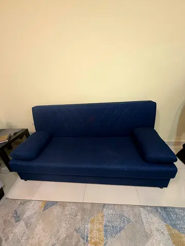 Blue sofabed with stores