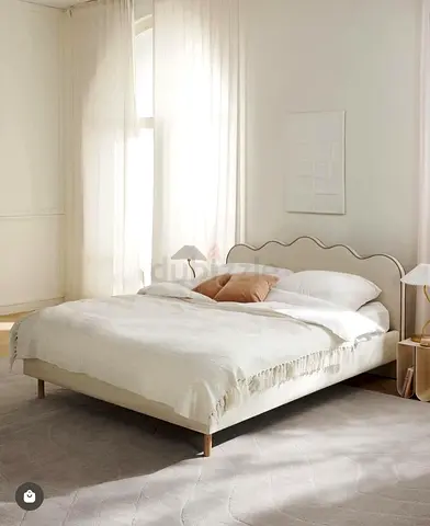 Modern scalloped upholstered double bed frame in beige
