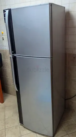 Sharp Silver double-door refrigerator with top freezer - good working condition