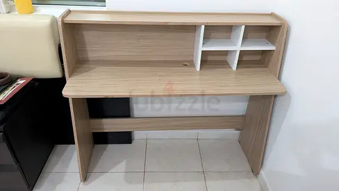 Light wood study desk with upper shelving